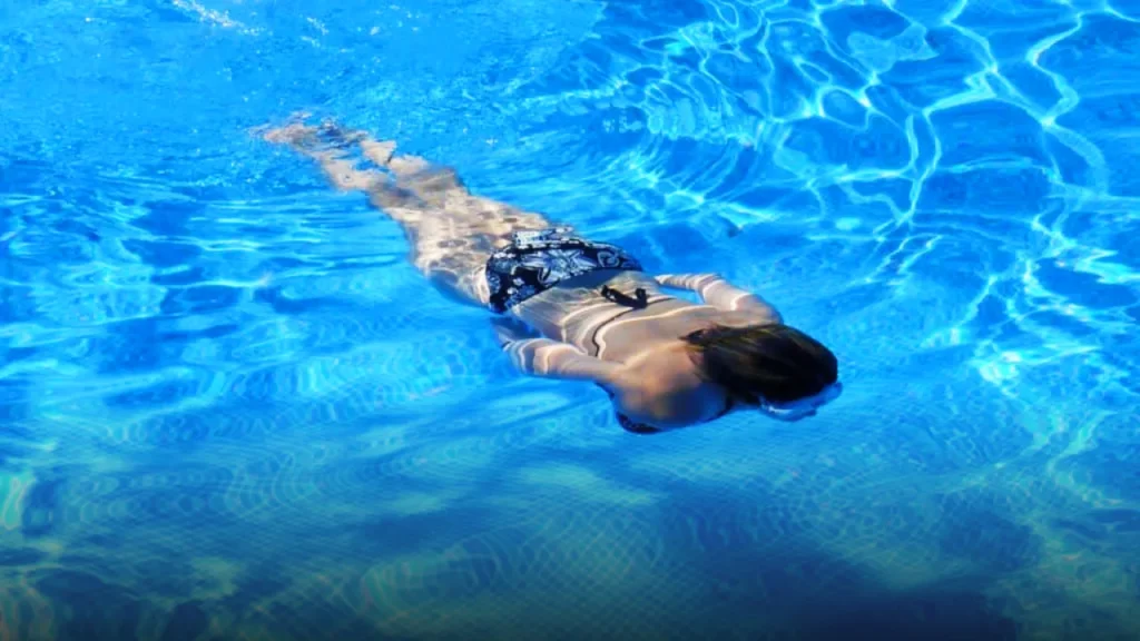 Beautiful Girl Swimming in the Water